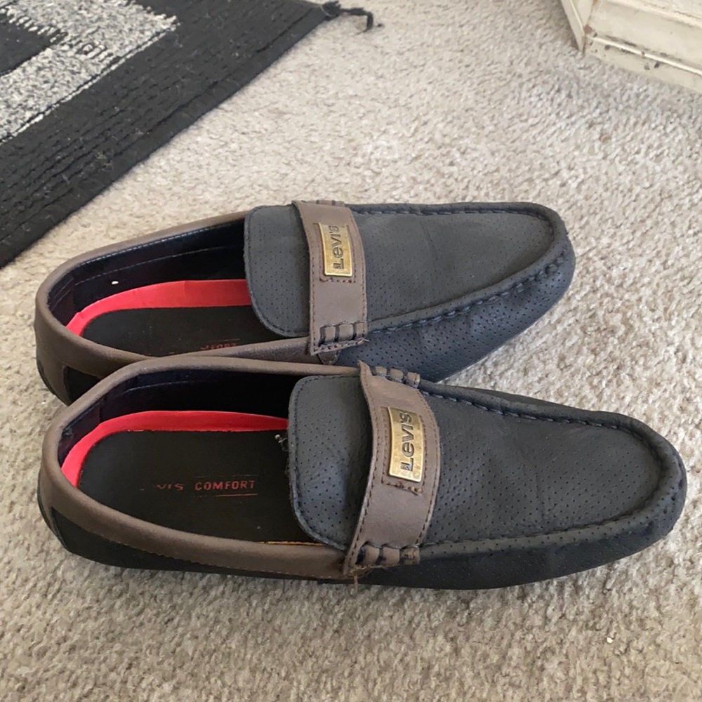 A brown and black Levi’s loafer